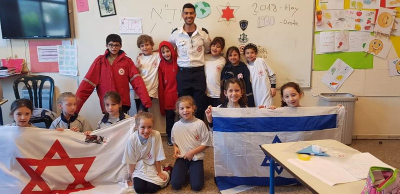 An MDA volunteer shares the ideals of the organization with kids in Uruguay