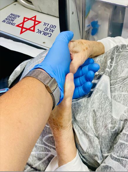 A paramedic and an elder patient