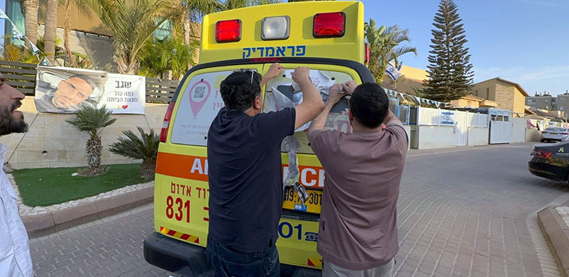 Hostage survivor Segev Kalfon Removes His Own Sticker from MDA Ambulance